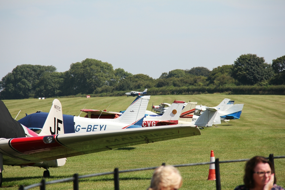 Aircraft parked on the grass at Compton Abbas airfield.