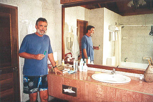 John threatens to shave his legs. (34k)