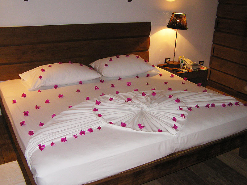 Your room boy will always decorate your bed with bougainvillea on your last night.  (87k)