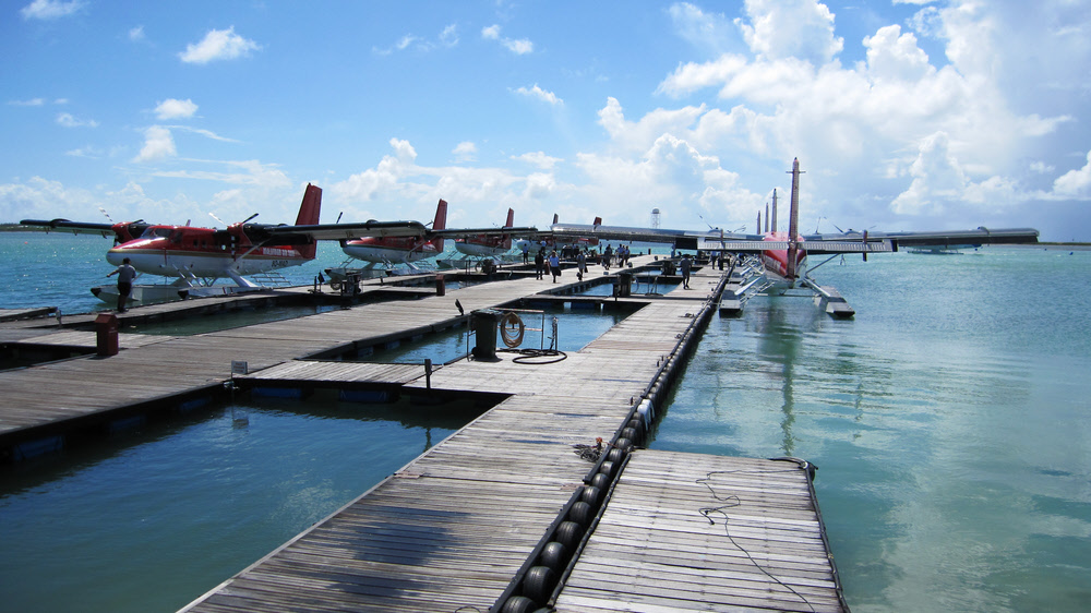 Twin Otters of Maldivian Air Taxis ready to take us to our holiday island.  (218k)