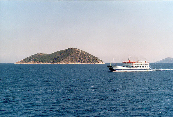 The car ferry passes Little Thassos Island on its way over to Thassos. (57k)