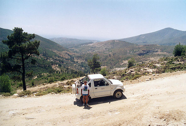 Our excellent Suzuki Jimny on the bumpy dirt track on the way up to Kastro.   (61k)