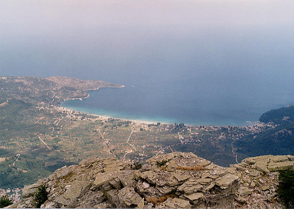 Another view from the top of Mount Ipsarion. The bay containing the resorts of Golden Beach (at the left of this picture) and Skala Potamia (at the right).  (60k)