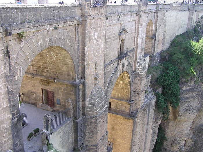 The bridge contains a museum, entered by the door at the lower left.  You can emerge on the balcony in the middle of the bridge, hundreds of meters above the river underneath.  (95k)