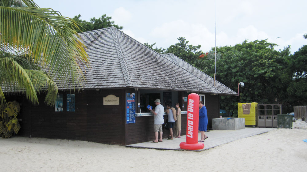 The Watersports and Dive Centre. The concrete rinse tank is in front of the yellow towel trolley.