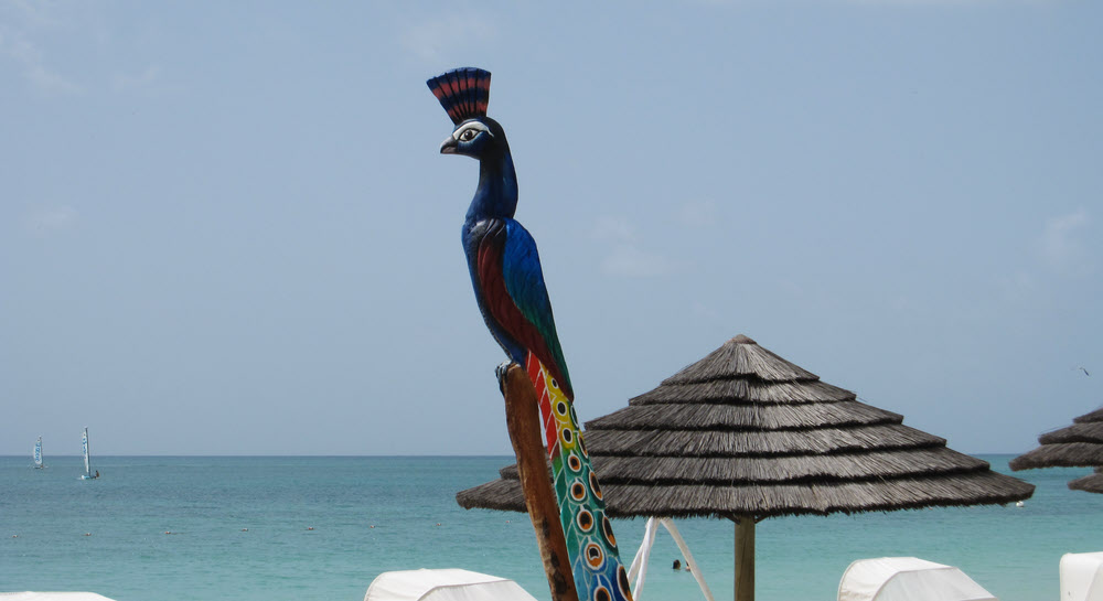 Carved, painted figures were dotted about in the gardens. This one was next to the beach.