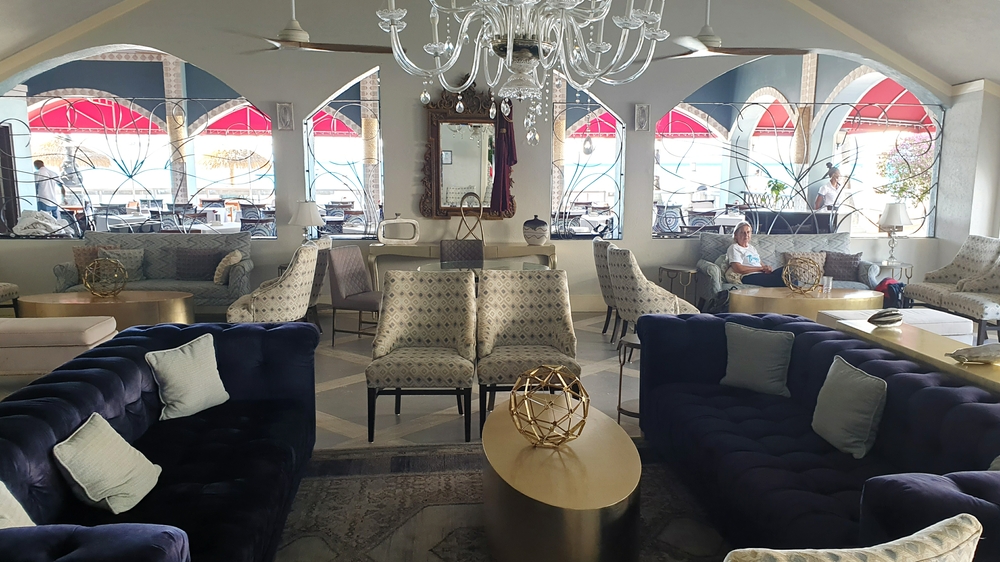 In the Courtyard's comfortable Crystal Lounge.  You can see Eleanor's restaurant through the windows, and the beach beyond it.