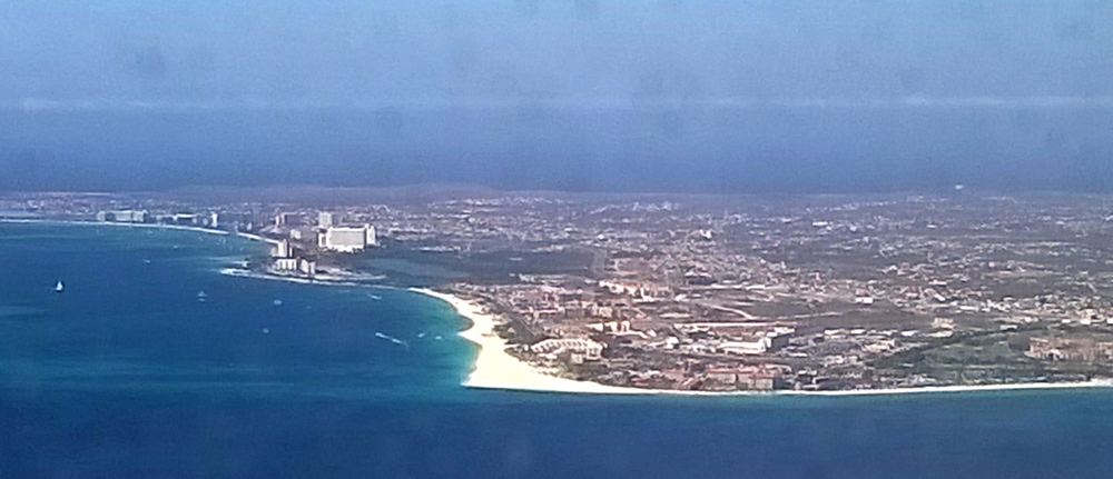 View out of the airplane window of the tourist-developed area on Aruba.