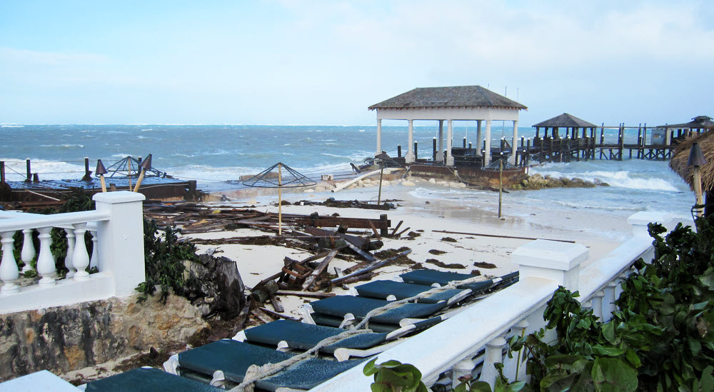 The wreckage from the pier is thrown up on the beach.