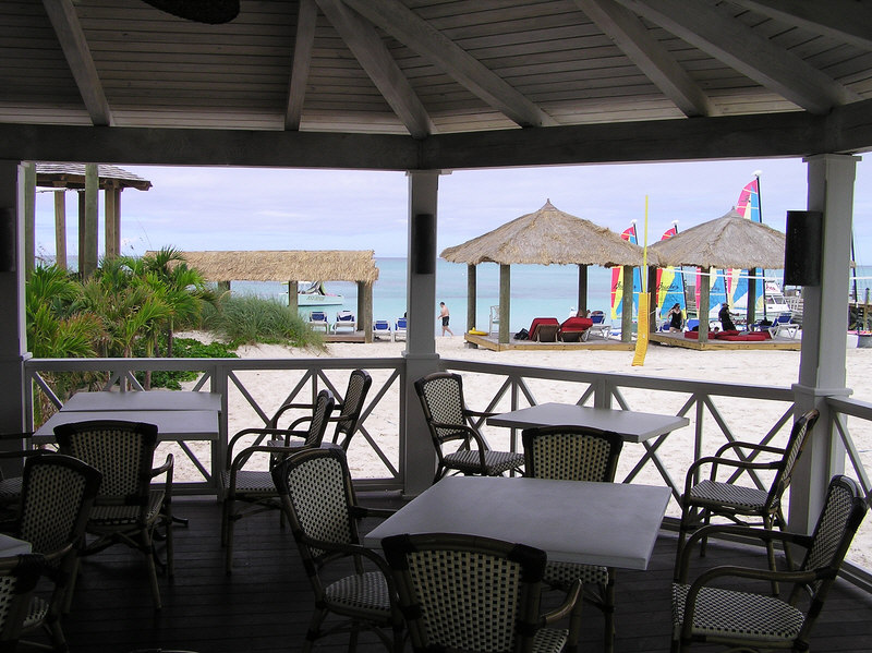 View from Schooners restaurant onto the beach, where you can see Hobie cats and windsurfers available from the water-sports centre. (152k)