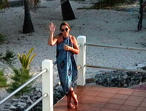 Linda on our balcony, desperately maintaining the constant struggle against dehydration