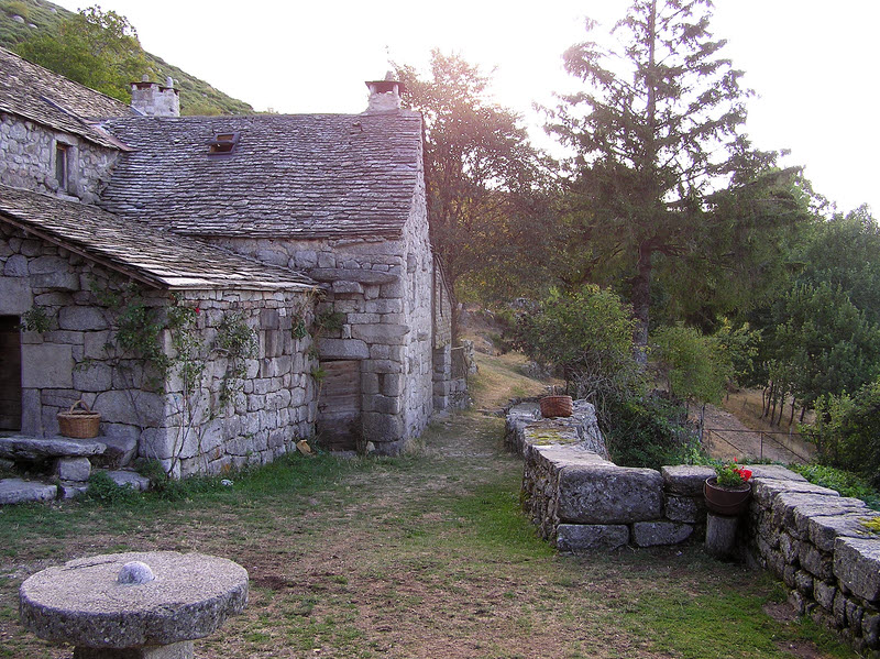 The terrace in front of the old stone farmhouse of le Merlet in the early morning.� (216k)