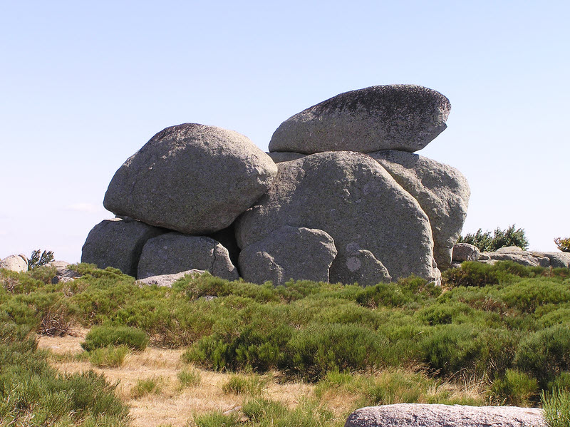 Huge piles of rounded boulders amongst the broom.  (156k)