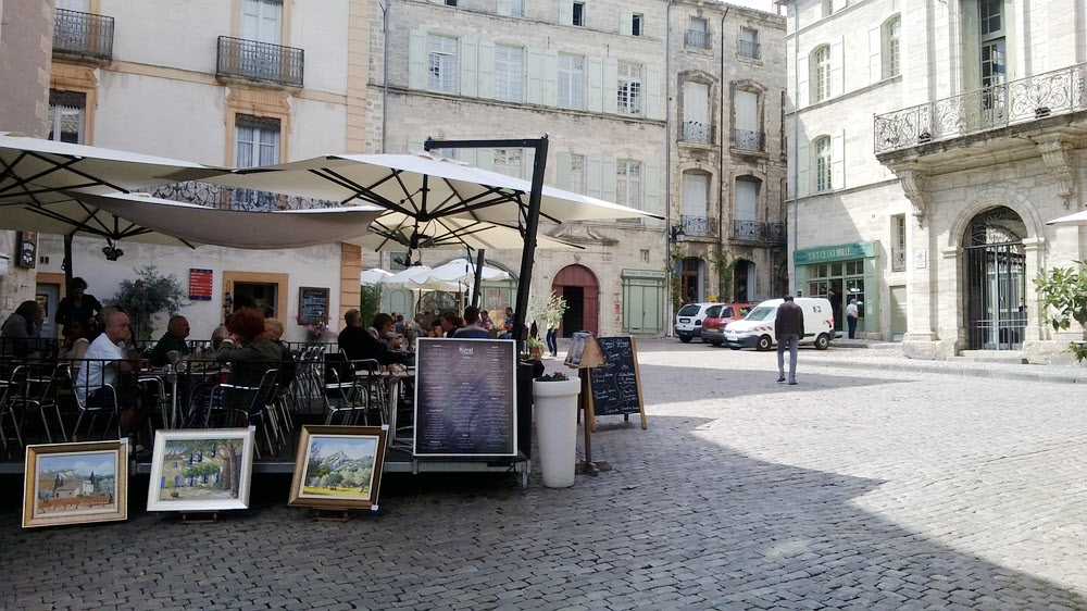A steep cobbled alleyway in Eus leads down to a small square with a welcome bistro.