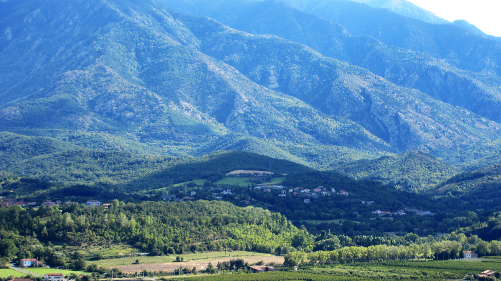 The villages comprising the commune of Los Masos nestling on the flanks of Canigou, as seen from across the valley. The gîte is in there somewhere.