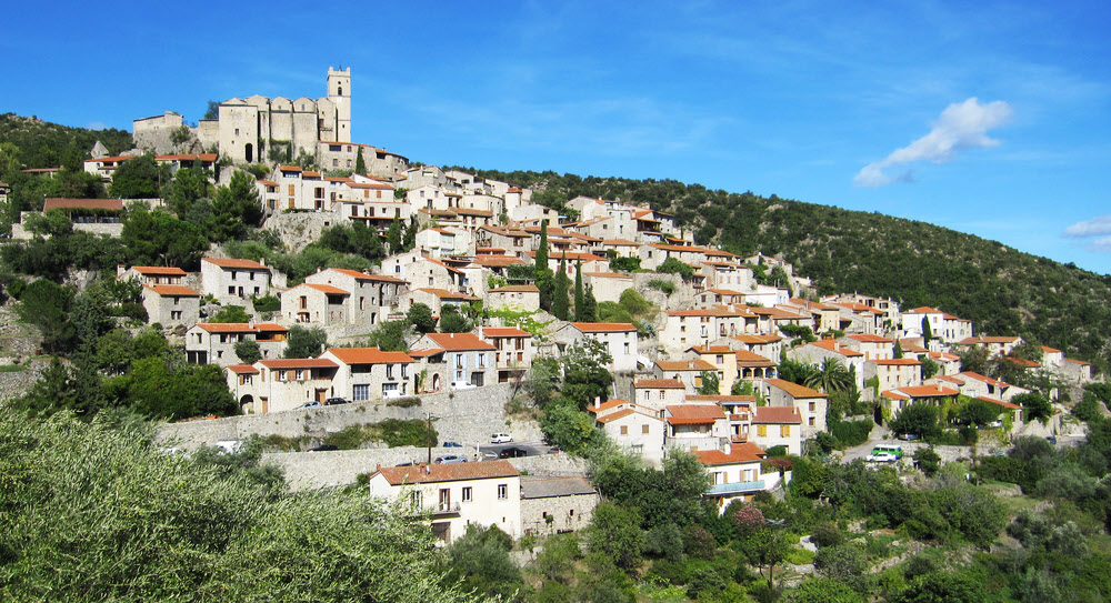 The precipitous village of Eus tumbles down the mountainside opposite Los Masos.