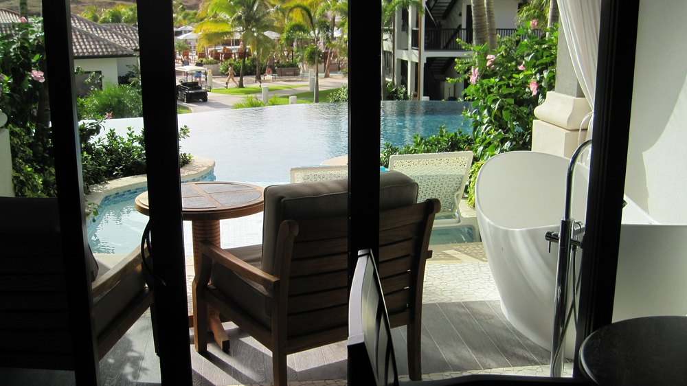 Looking through the door out to the veranda and the pool.