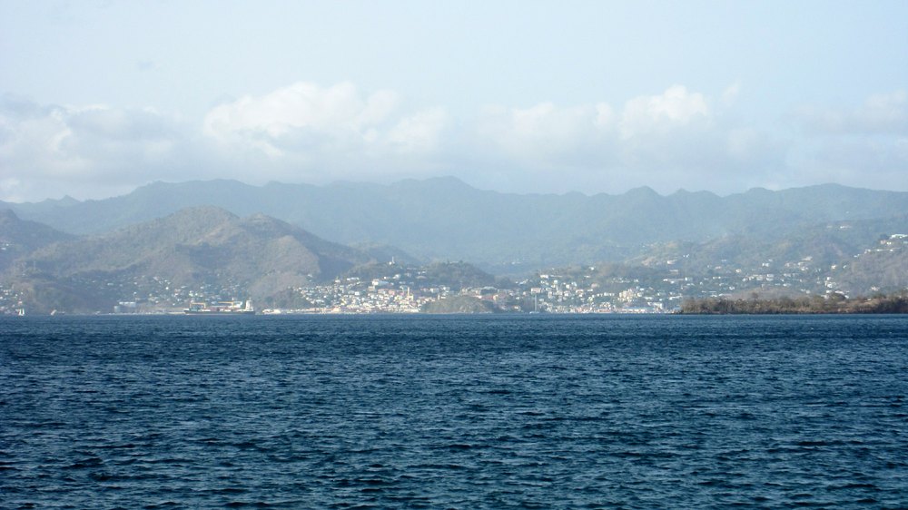 Again, from the same viewpoint on the pier, looking across the bay to the capital, St George's, and the mountains behind.