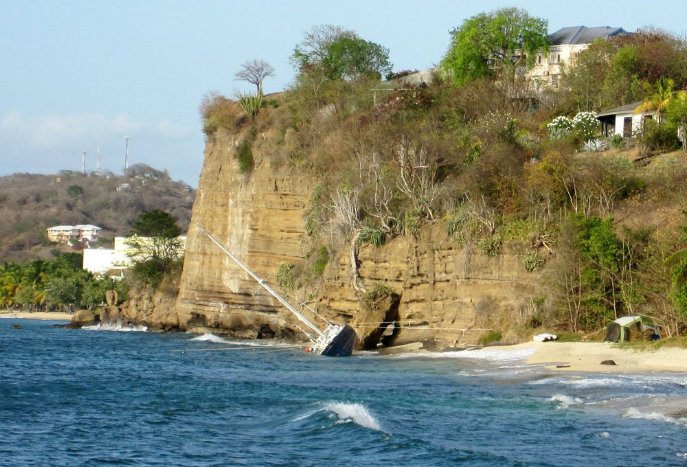 From the same viewpoint, looking further along the beach, where a Canadian-registered yacht had been wrecked, and is awaiting salvage.