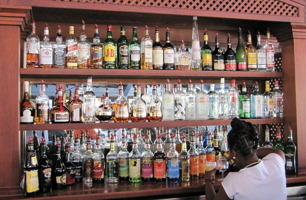 Behind the bar at The Living Room. The all-inclusive deal includes for example Glenfiddich 12-yr old single malt (top row, left of centre), 
						and a choice of Gordon's, Tanqueray, Beefeater or Bombay Sapphire gins (middle row, right).