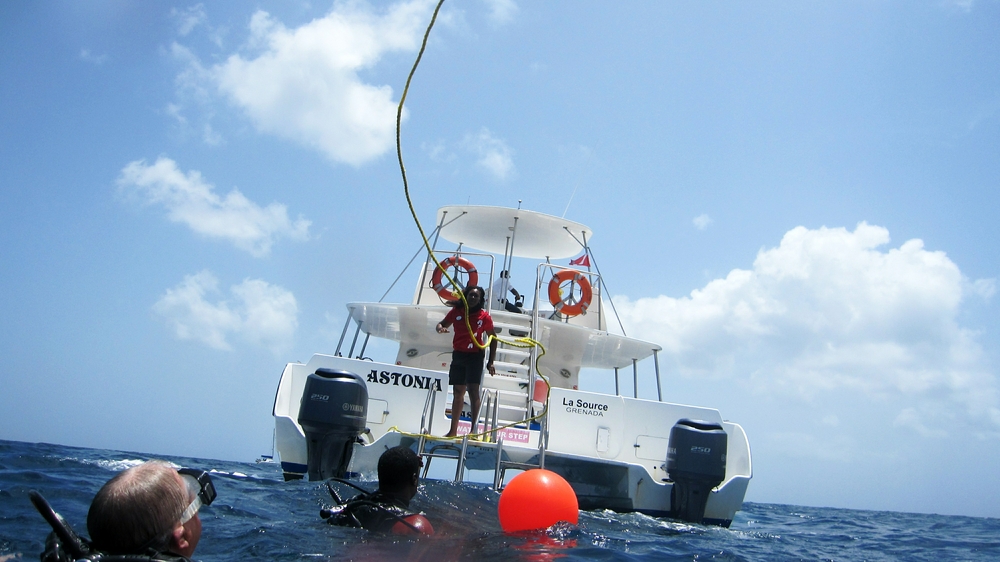 The end of the dive - we are thrown a floating line to grab hold of to ensure we don't drift away from the MV 'Astonia' dive boat.