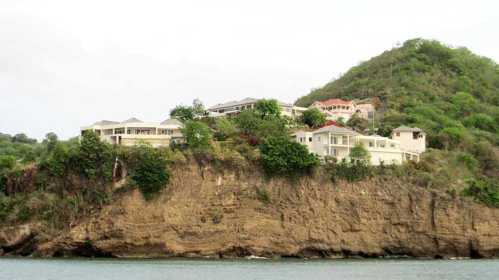 During the sunset sail, we passed beneath some rather nice clifftop pads. Lewis Hamilton owns the one on the right, with Morgan Freeman's at the left. 
        Between and behind is Oprah's. I don't know who owns the red-roofed building at the back.