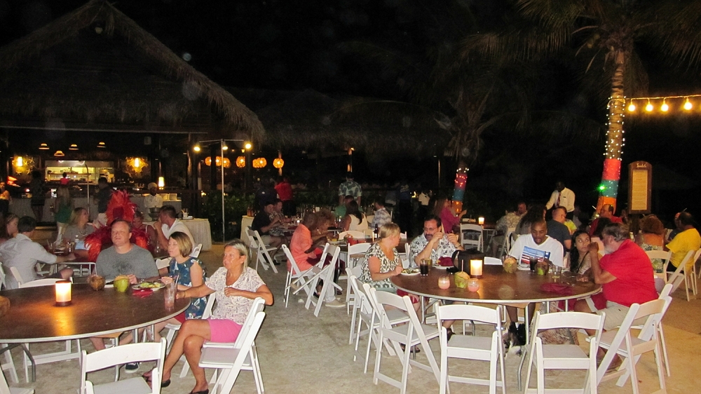 Tables and chairs are also set up by the beach. 