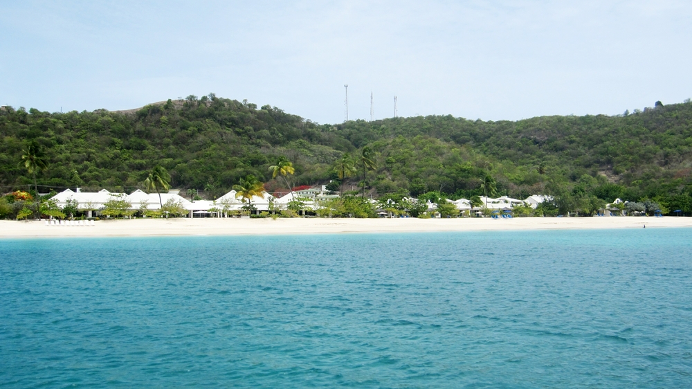 The first time we came to Grenada in 1992, we stayed at the Spice Island Inn on Grande Anse Beach.  It's still there, 
          seen here from the dive boat, after changing tanks at a dive centre just along the beach from it.