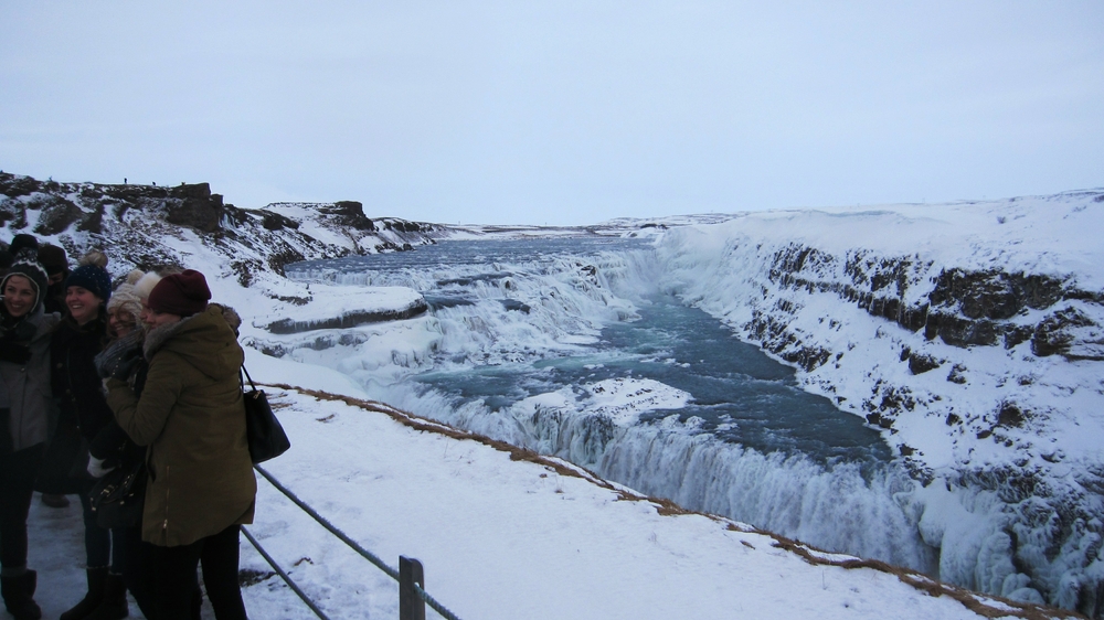 Now you can see part of the lower drop as well. There was a near-gale force bitter wind blowing through this canyon from the
					 glacier upstream. It was hard to keep your feet as the wind battered you on the slippery, ice-covered viewing area. 