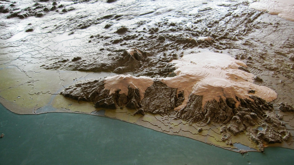 In the basement of the Parliament building, there's a scale model of Iceland - this small section shows the area around Eyjafjallajökull, 
						which caused much disruption to air traffic in Europe in 2010 from its immense ash cloud.