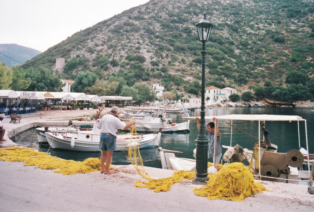 Fishermen sort out their nets at Frikes, Ithaca.