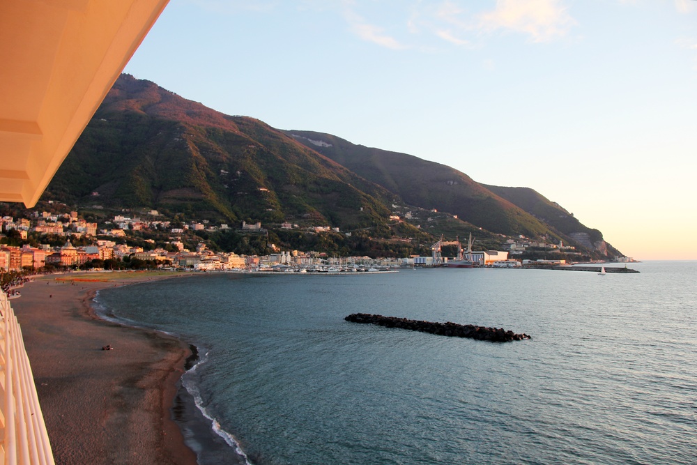 On our balcony, looking south-west towards Sorrento (just round the corner of the headland) at sunset. With its railings and portholes, the hotel
        looks like an ocean liner. 