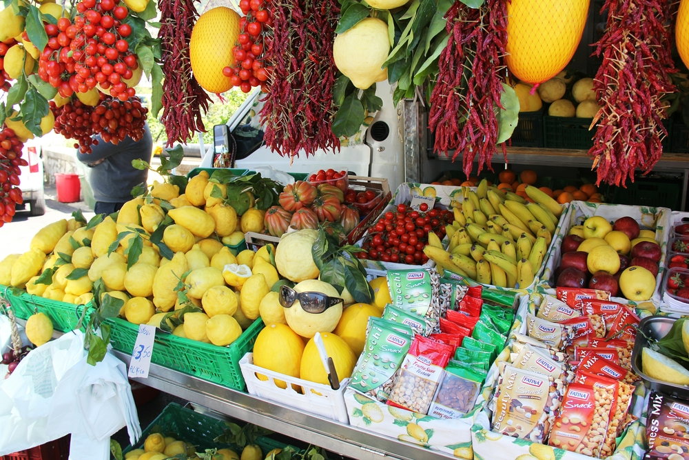 Fruit and vegetable stall selling the largest lemons we've seen.