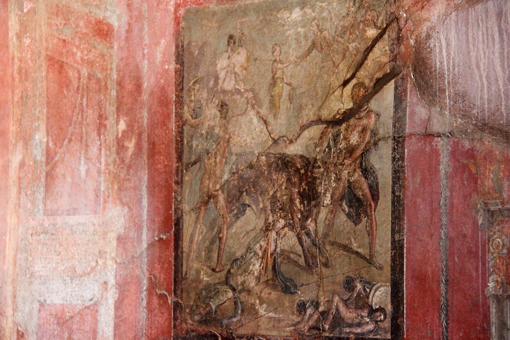 This apparently represents the 'Punishment of Dirce'. Dirce was an unpleasant woman who wanted to tie her nephew Antiope to the horns of a wild bull,
        but after a bit of to-ing and fro-ing Antiope was rescued and Dirce was tied to the bull instead. Charming.