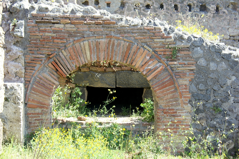 A bread oven in a bakery. It looks just like a modern pizza oven.