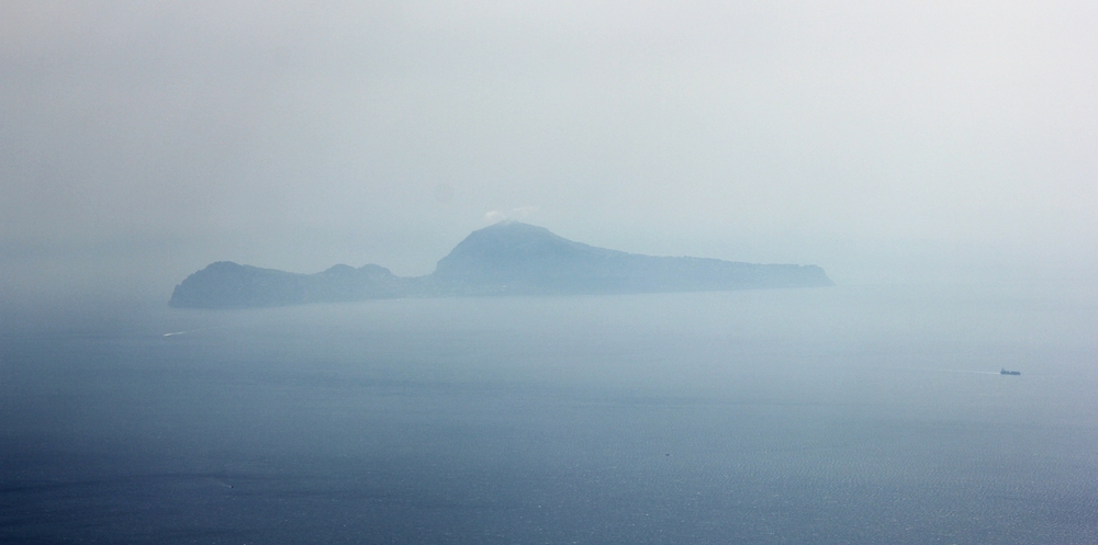 The island of Capri off in the south-west, 35 kilometres away in the haze.