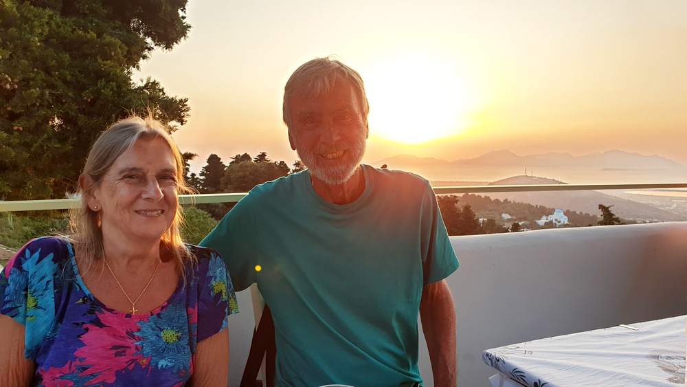 Enjoying a good meal on the sundeck of the Olympia 2 restaurant in Zia, as the sun sets behind us.