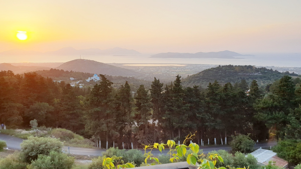 The view from Zia across the coastal plain and over the Aegean sea toward the island of Pserimos.