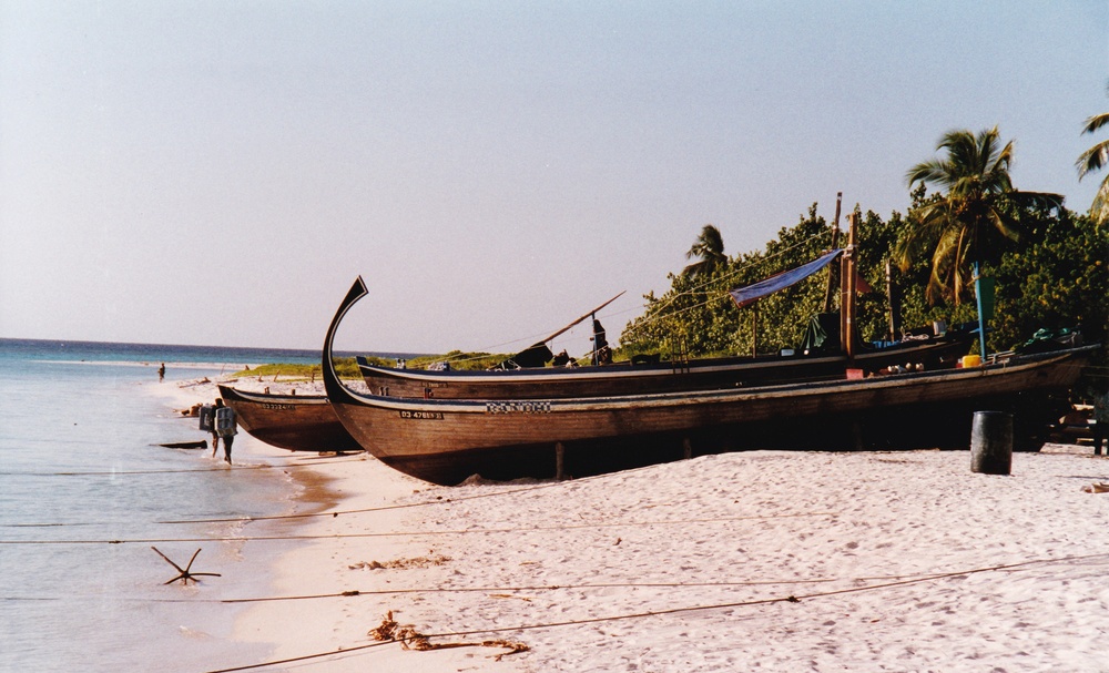 Dhonis (Maldivean boats) on the beach on the inhabited island of Ukalash.