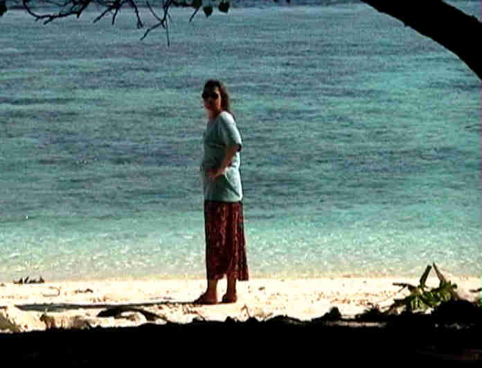 Linda on the beach of an inhabited island, whose name escapes me..