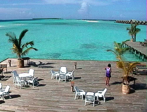 Some of the water bungalows are visible at the right. Ari Beach is off to the left.