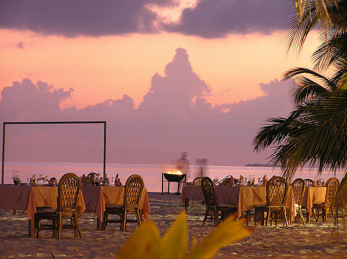 Dining tables would be set up on the beach, so we could eat under the stars.  (60k)