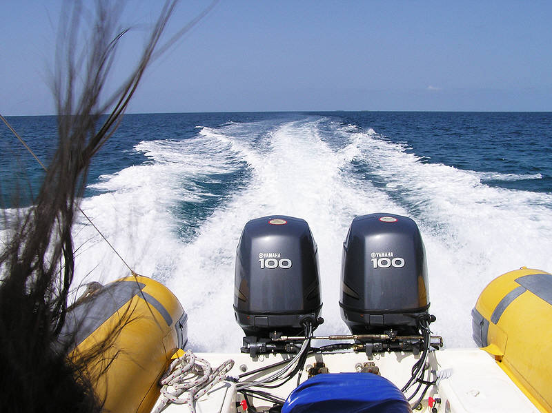 The speedboat carries us away to Athuruga.  (86k)