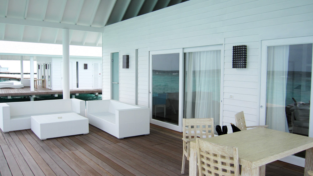 The deck area, showing the two sets of sliding doors into the villa, and the separate door at the far end into the shower. (124k)