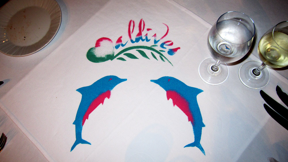 Our restaurant table was decorated with this tableau in coloured sand by our waiter Mohammed.