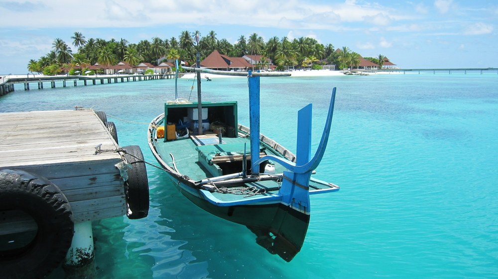 He beat us to it. Tied up to the jetty in crystal-clear water.