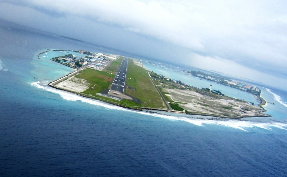 As we pass by the international airport on Hulule island, you can make out an airliner at the near end of the runway waiting 
						to take off. The international terminal is to the left of the runway, with the seaplane terminal in the lagoon to the right of the runway.