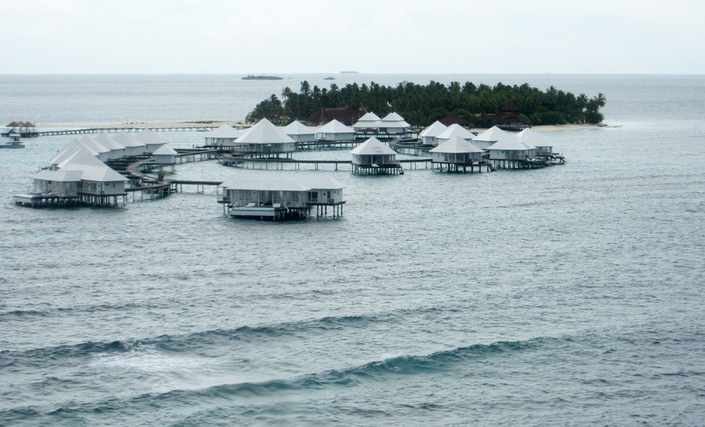 Thudufushi from the seaplane as we come in to land on the lagoon.  On the horizon in the middle of the photo is sister-island Athuruga.