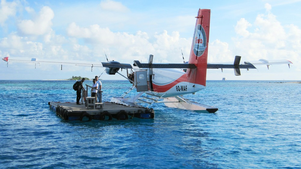 The Twin Otter seaplane tied up to the pontoon in the lagoon at Thudufushi. 