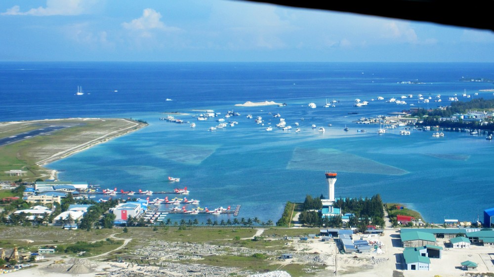 The seaplane terminal at Male Airport, with the end of the main international runway visible at the left. 